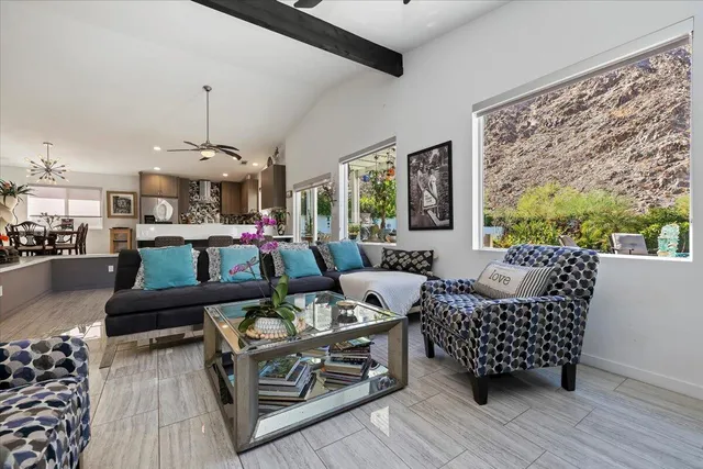 a view of living room with furniture and window
