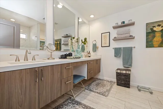 a bedroom with bed and chair