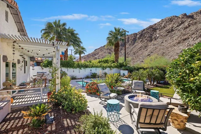 a view of a chairs and table in patio
