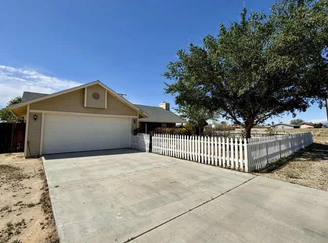 a front view of a house with a garage
