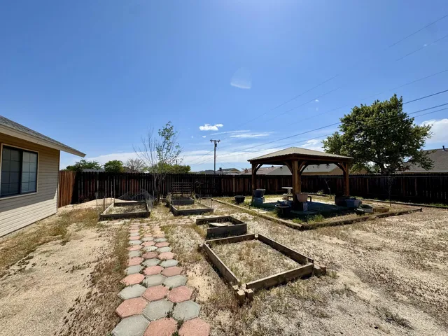 a view of a backyard of the house