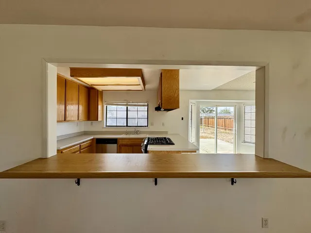 a kitchen with a sink and a window