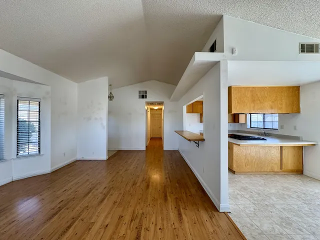 a view of a living room with a wooden floor