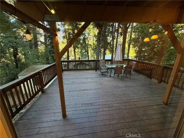a living room with furniture a rug and a chandelier