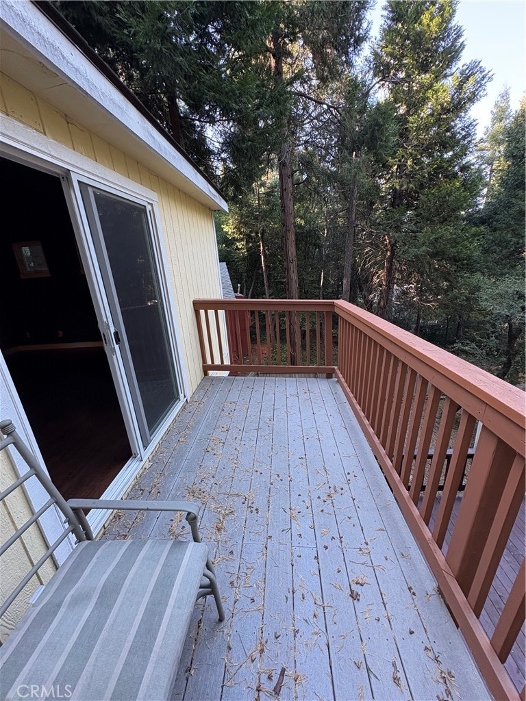 743 Woodland Road Crestline, CA 92325 - Photo 15 of 57 a view of balcony with wooden floor and fence