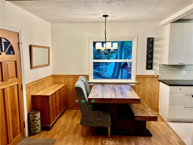 a stove top oven sitting inside of a kitchen