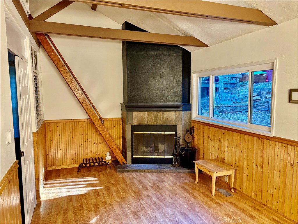 743 Woodland Road Crestline, CA 92325 - Photo 17 of 57 a living room with furniture and a fireplace