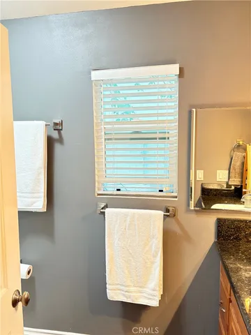 a view of a door and a window