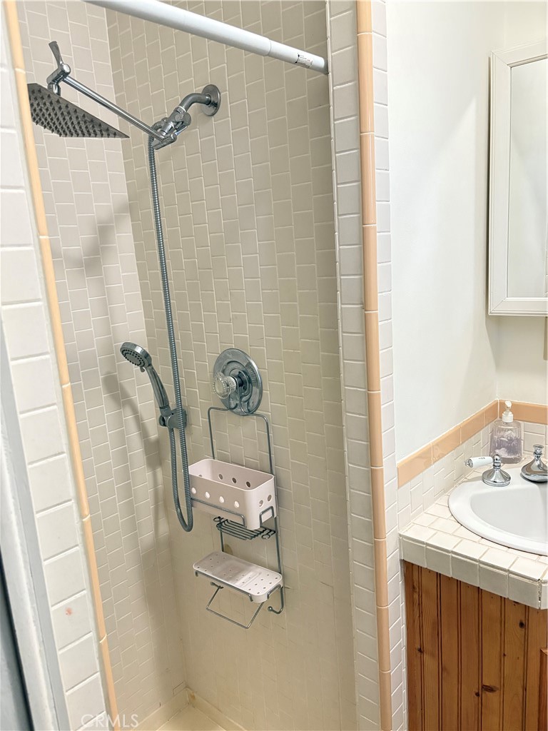 743 Woodland Road Crestline, CA 92325 - Photo 33 of 57 a bathroom with a sink a toilet and shower