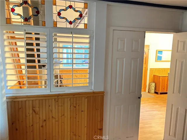 a living room with wooden floors and a fireplace