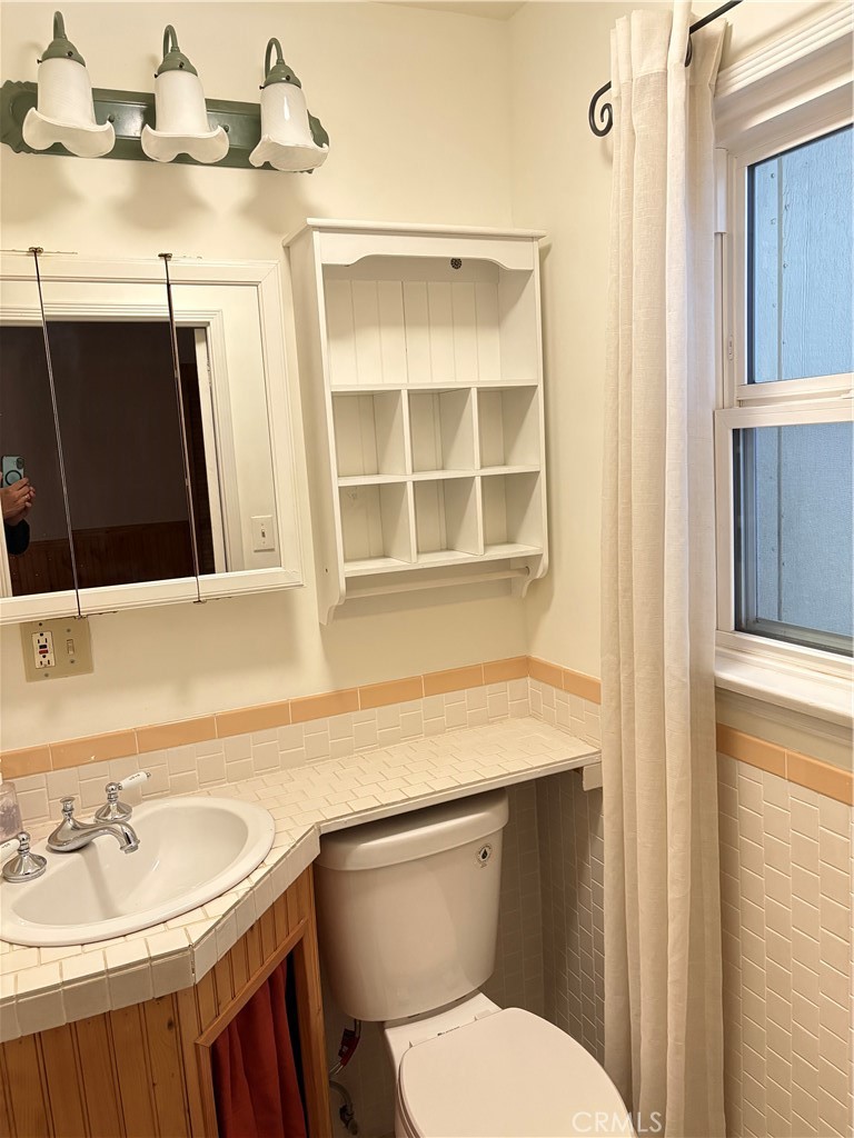 743 Woodland Road Crestline, CA 92325 - Photo 37 of 57 a bathroom with a sink and a toilet