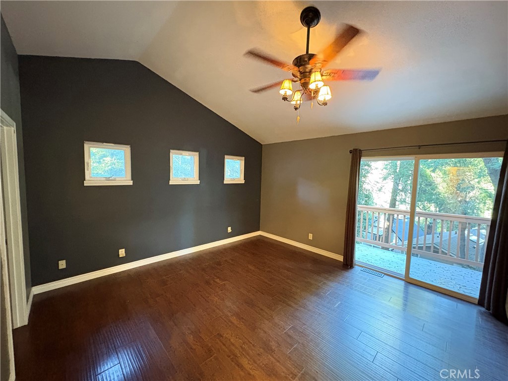 743 Woodland Road Crestline, CA 92325 - Photo 40 of 57 a view of an empty room with wooden floor and a window
