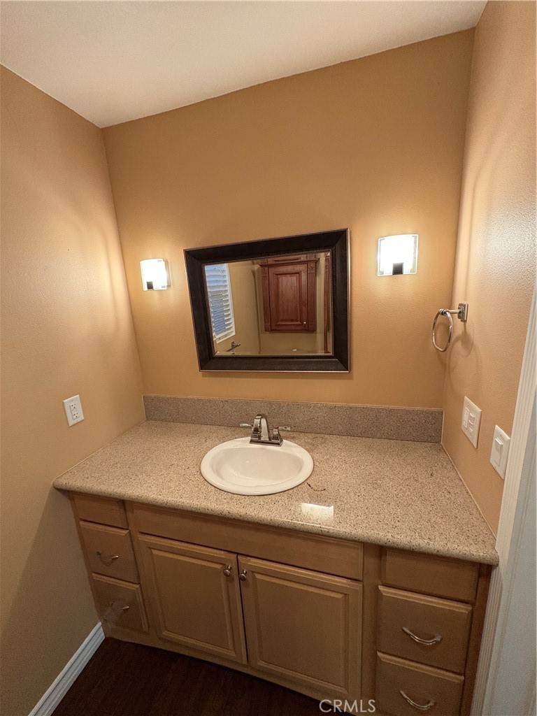 743 Woodland Road Crestline, CA 92325 - Photo 50 of 57 a bathroom with a sink and a mirror