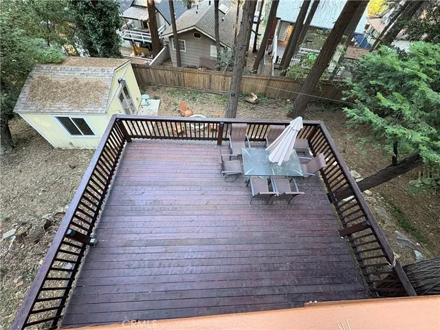 a view of a balcony with trees