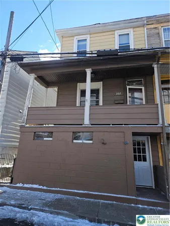 a view of house with roof deck