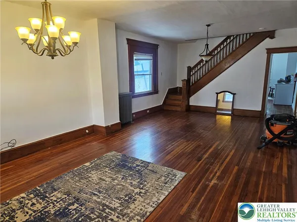 a view of entryway with wooden floor