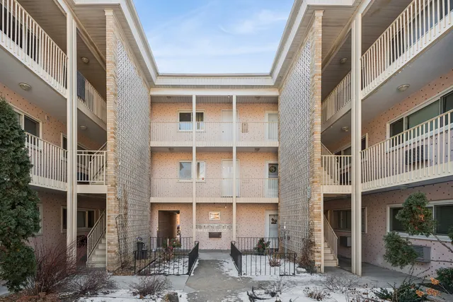 a front view of a building with a lot of windows