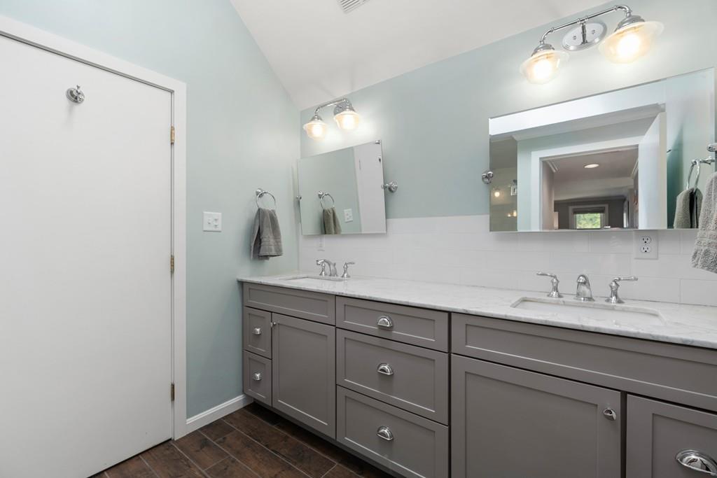 16 Standish Road Wayland, MA 01778 - Photo 13 of 22 a bathroom with a double vanity sink and a mirror