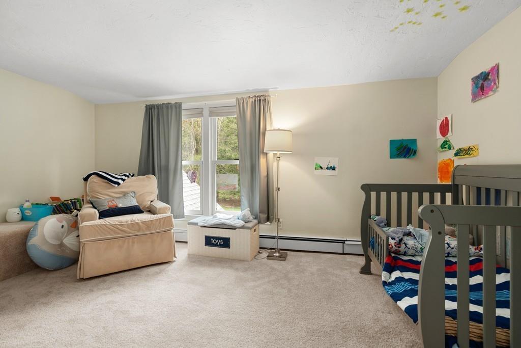 16 Standish Road Wayland, MA 01778 - Photo 17 of 22 a living room with furniture and a floor to ceiling window