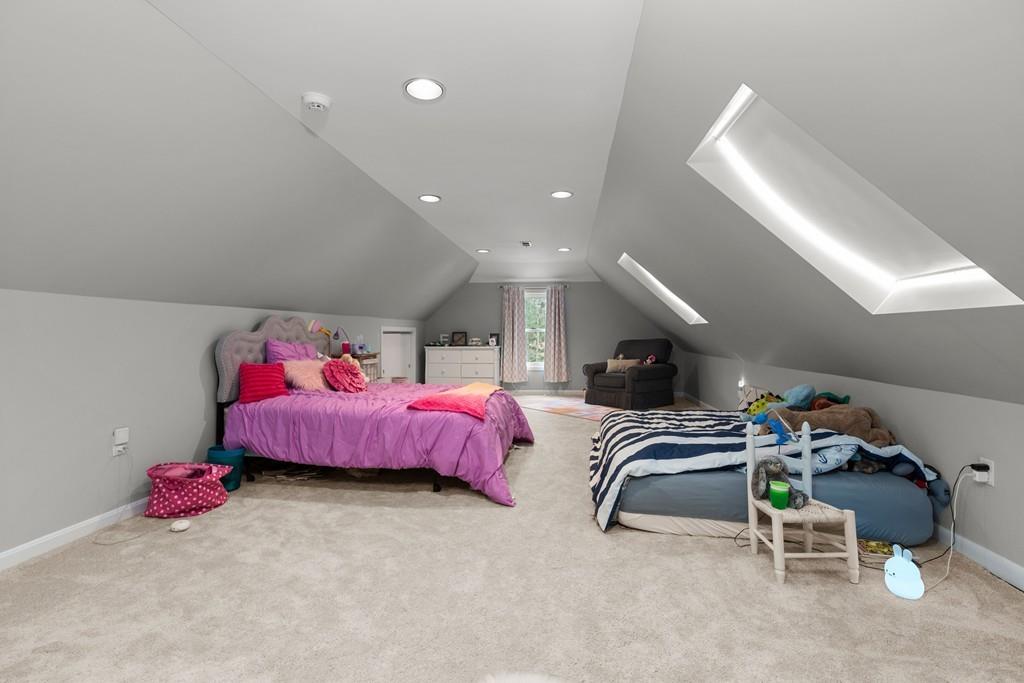 16 Standish Road Wayland, MA 01778 - Photo 18 of 22 a bedroom with furniture and a chandelier