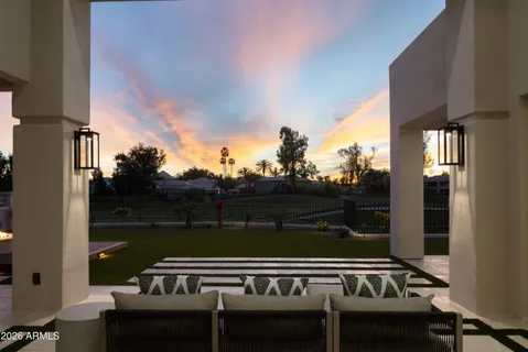 a view of a roof deck with couches and wooden floor