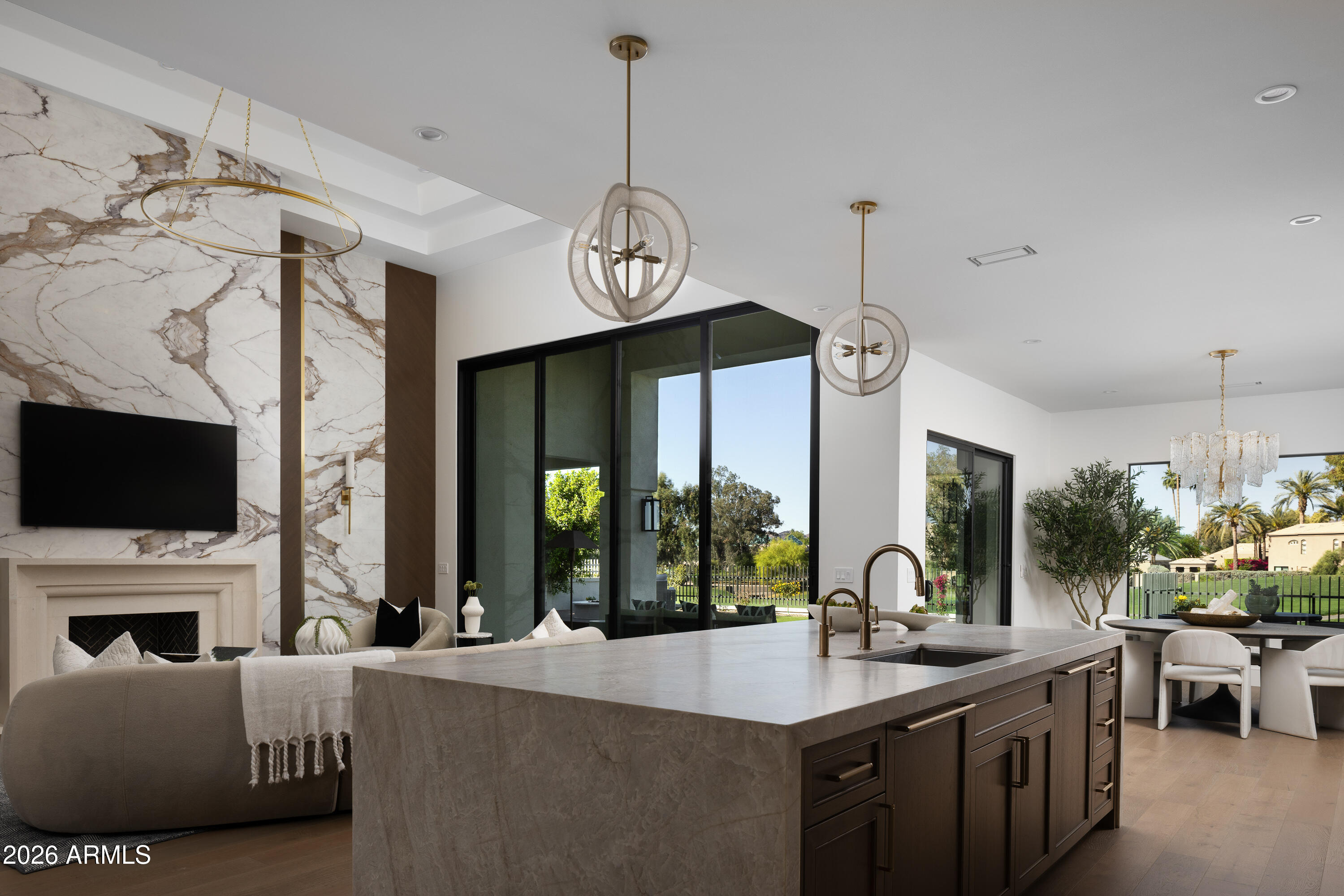 7878 East Gainey Ranch Road, Unit 14 Scottsdale, AZ 85258 - Photo 40 of 40 a living room with fireplace furniture and a flat screen tv