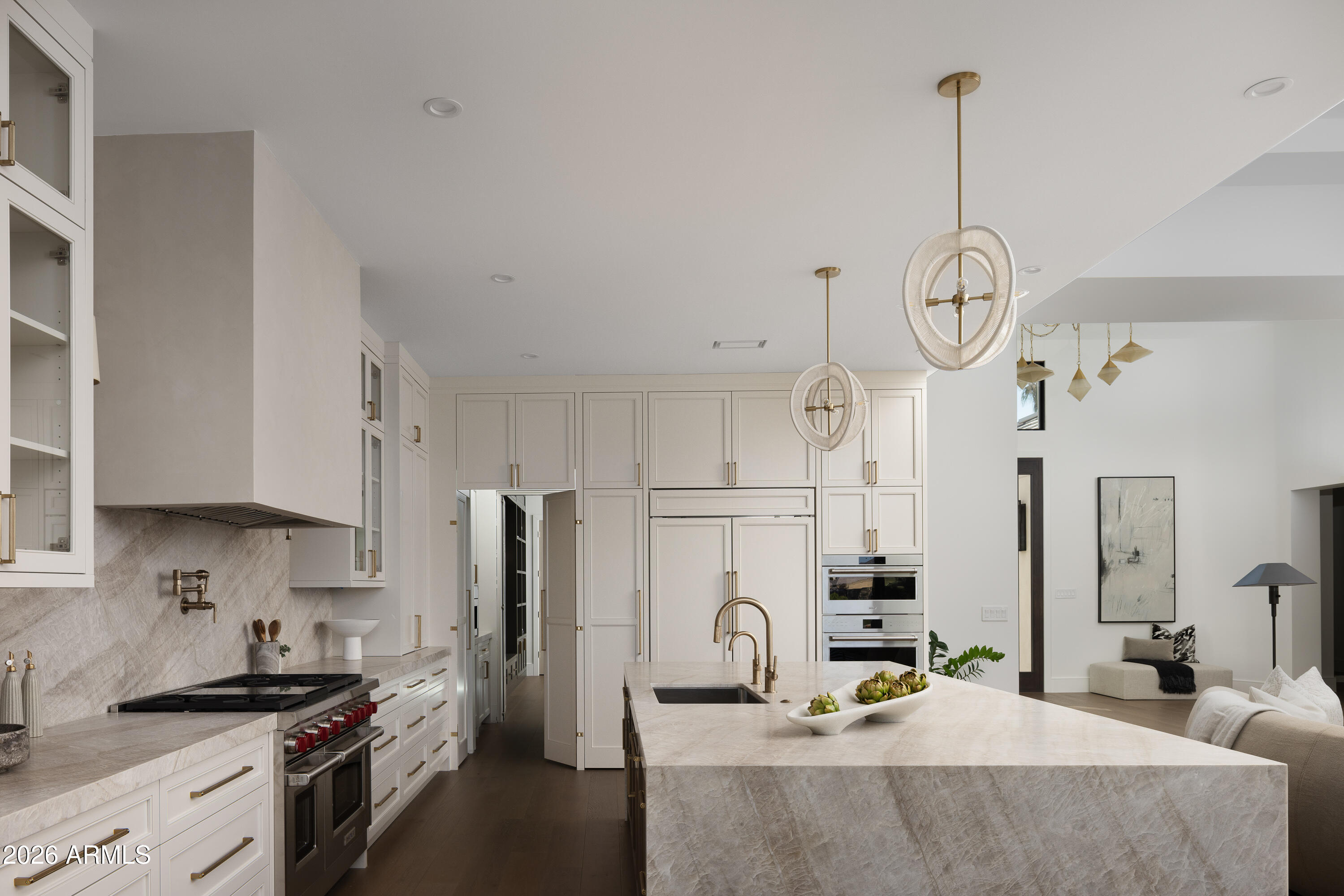 7878 East Gainey Ranch Road, Unit 14 Scottsdale, AZ 85258 - Photo 14 of 40 a kitchen with kitchen island granite countertop a sink cabinets and stainless steel appliances