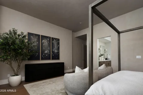 a spacious bedroom with a bed and large window