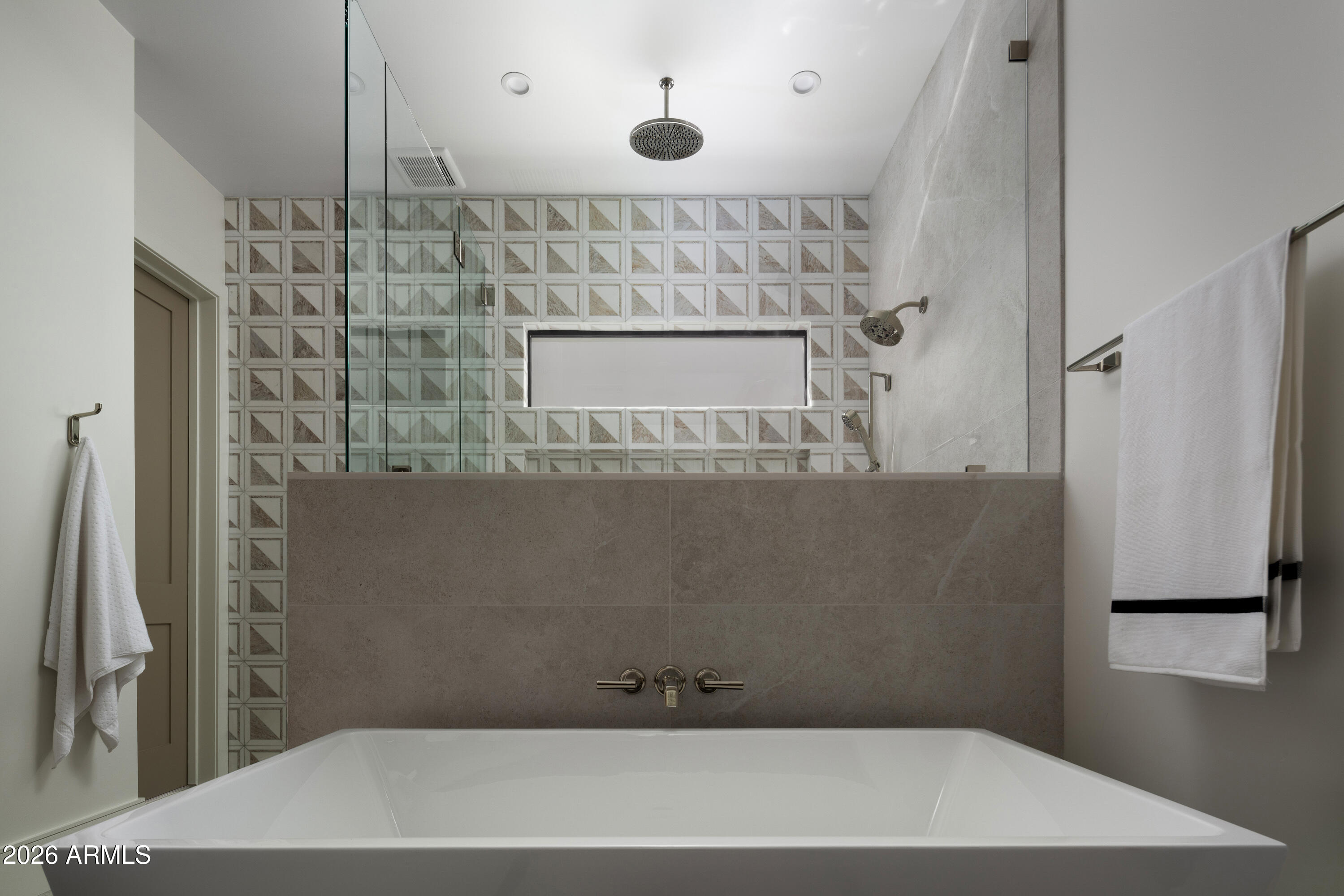7878 East Gainey Ranch Road, Unit 14 Scottsdale, AZ 85258 - Photo 20 of 40 a bathroom with a bathtub and a shower