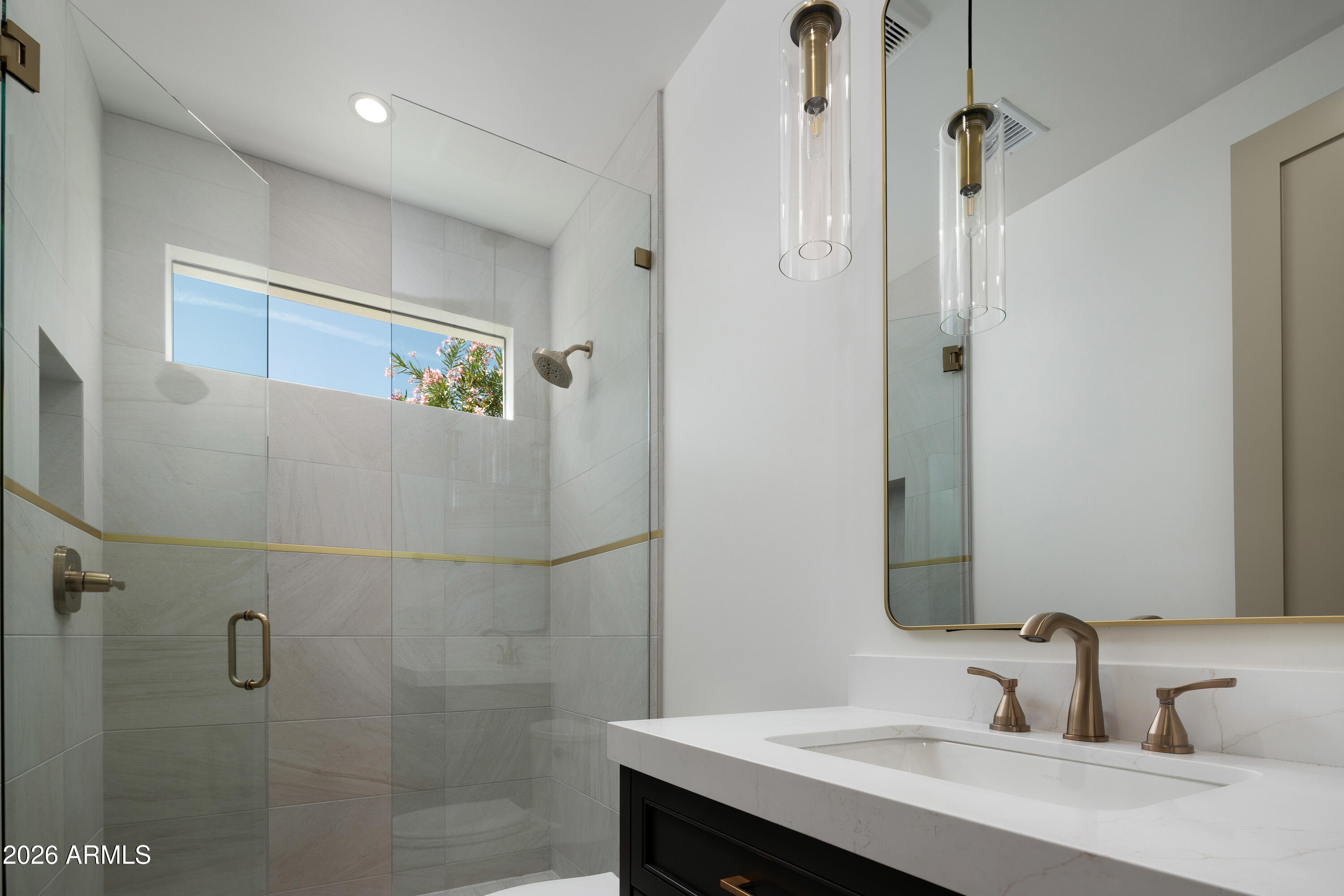 7878 East Gainey Ranch Road, Unit 14 Scottsdale, AZ 85258 - Photo 22 of 40 a bathroom with a sink and mirror