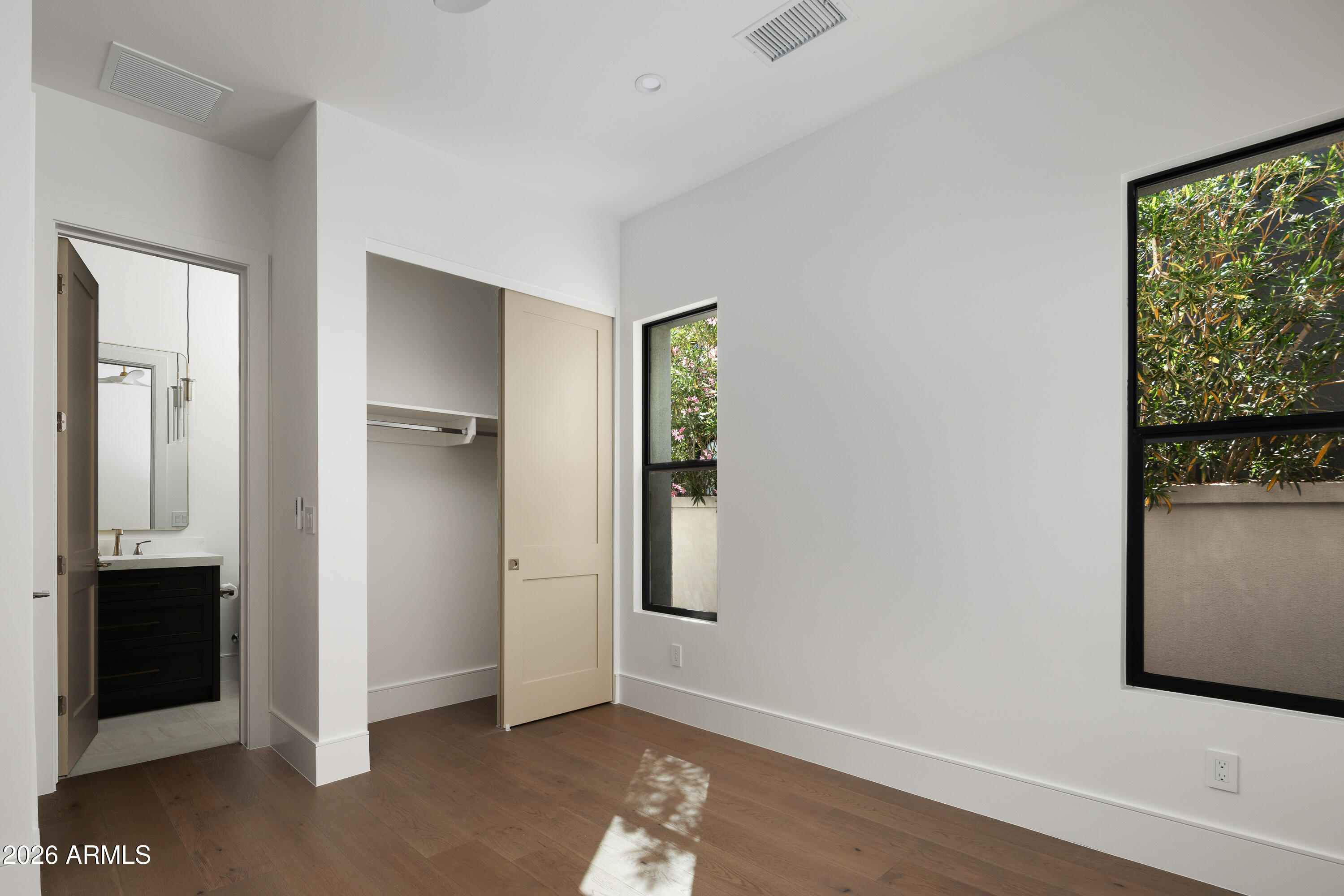 7878 East Gainey Ranch Road, Unit 14 Scottsdale, AZ 85258 - Photo 23 of 40 an empty room with windows and closet
