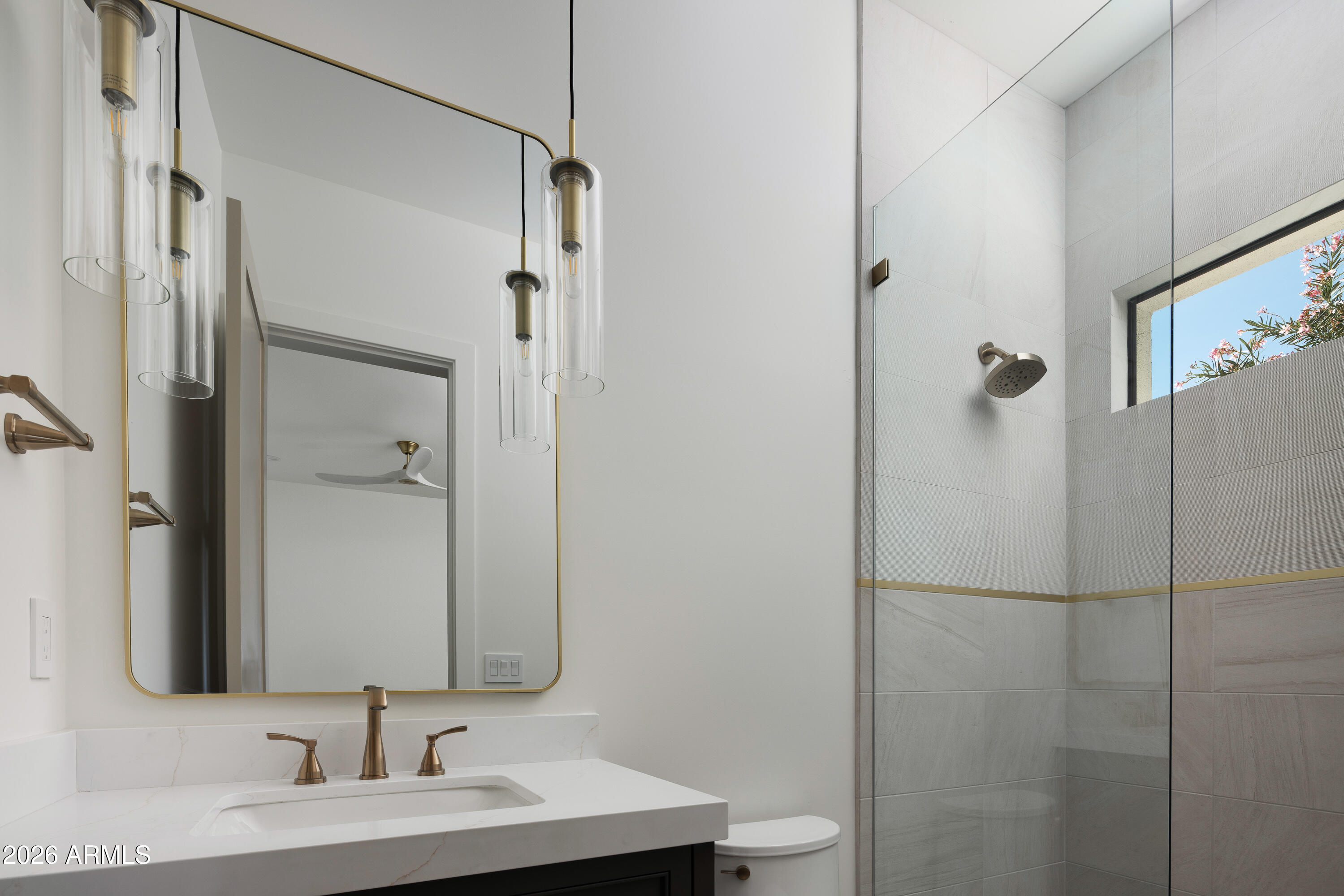 7878 East Gainey Ranch Road, Unit 14 Scottsdale, AZ 85258 - Photo 24 of 40 a bathroom with a sink and mirror