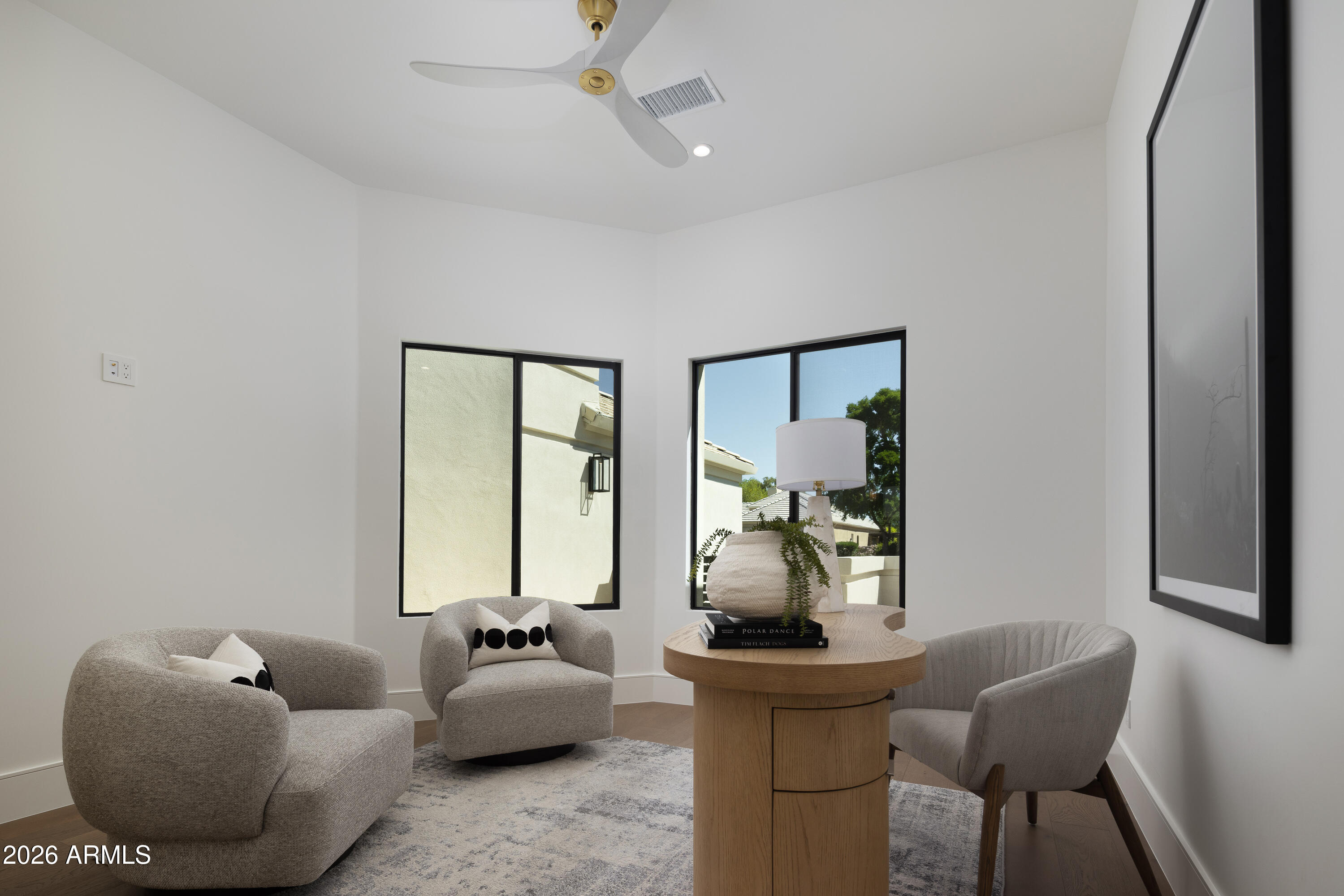 7878 East Gainey Ranch Road, Unit 14 Scottsdale, AZ 85258 - Photo 25 of 40 a living room with furniture and a window
