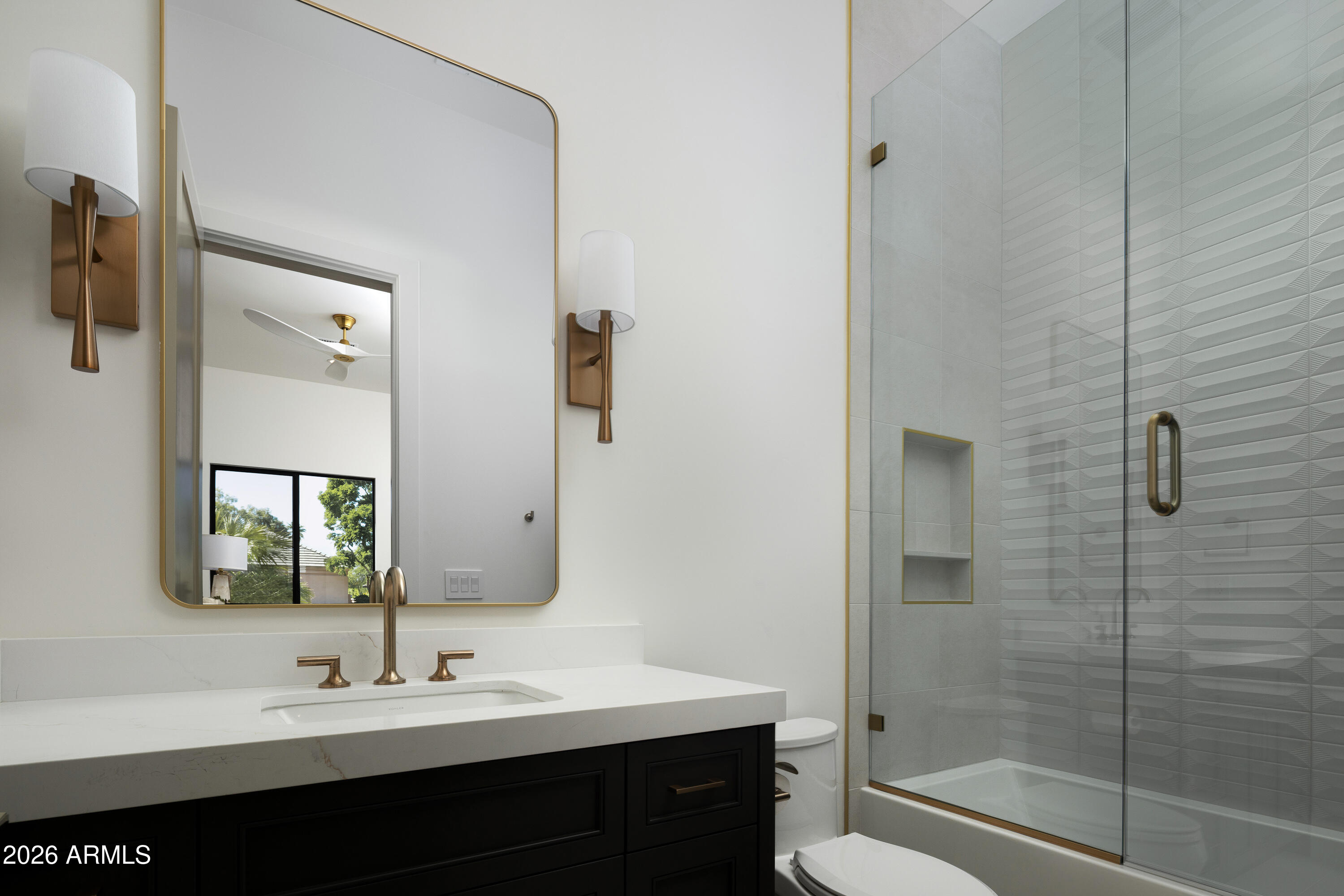 7878 East Gainey Ranch Road, Unit 14 Scottsdale, AZ 85258 - Photo 26 of 40 a bathroom with a double vanity sink mirror and shower