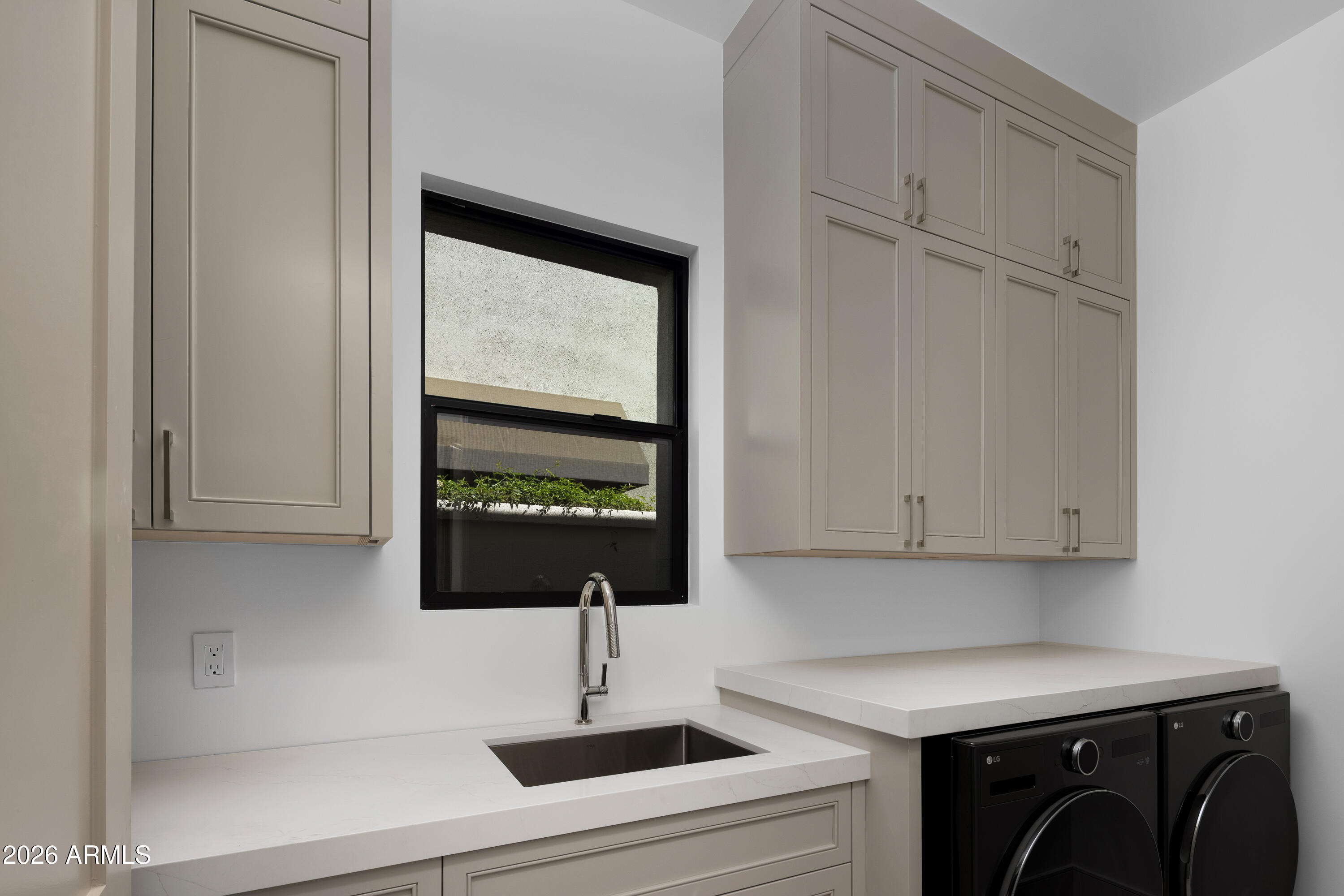 7878 East Gainey Ranch Road, Unit 14 Scottsdale, AZ 85258 - Photo 29 of 40 a kitchen with a sink and cabinets
