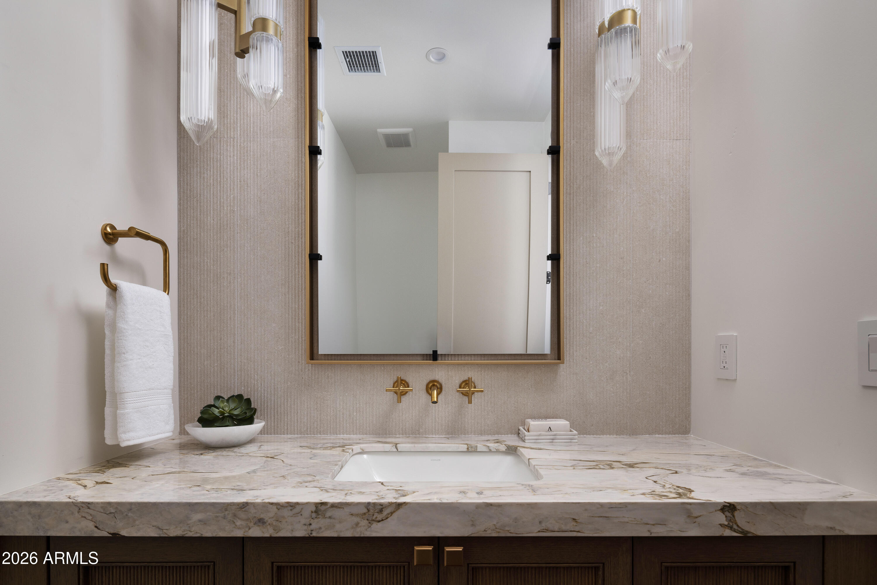 7878 East Gainey Ranch Road, Unit 14 Scottsdale, AZ 85258 - Photo 30 of 40 a bathroom with a granite countertop sink and a mirror