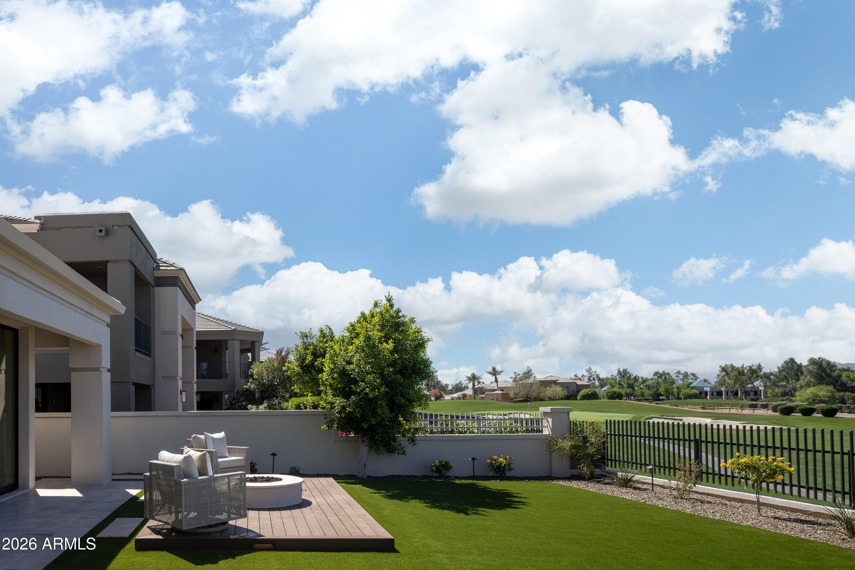 7878 East Gainey Ranch Road, Unit 14 Scottsdale, AZ 85258 - Photo 31 of 40 a view of a house with a back yard
