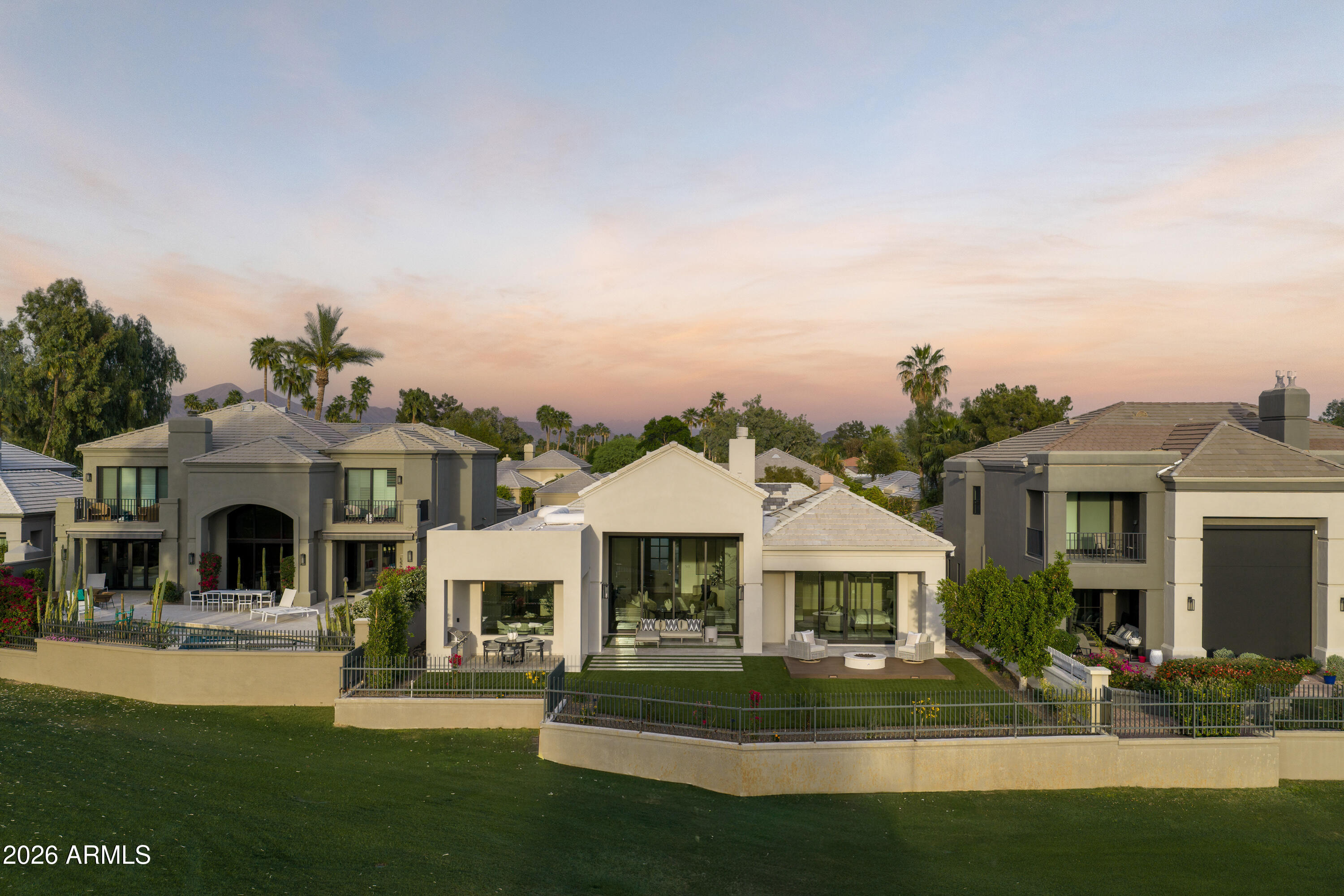 7878 East Gainey Ranch Road, Unit 14 Scottsdale, AZ 85258 - Photo 33 of 40 a front view of a house with a yard
