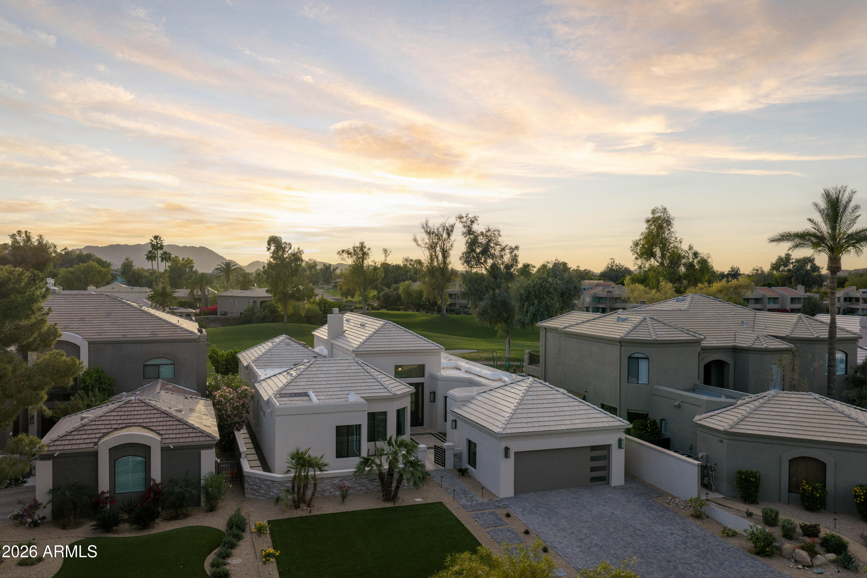 7878 East Gainey Ranch Road, Unit 14 Scottsdale, AZ 85258 - Photo 34 of 40 a view of a house with a garden and sitting area