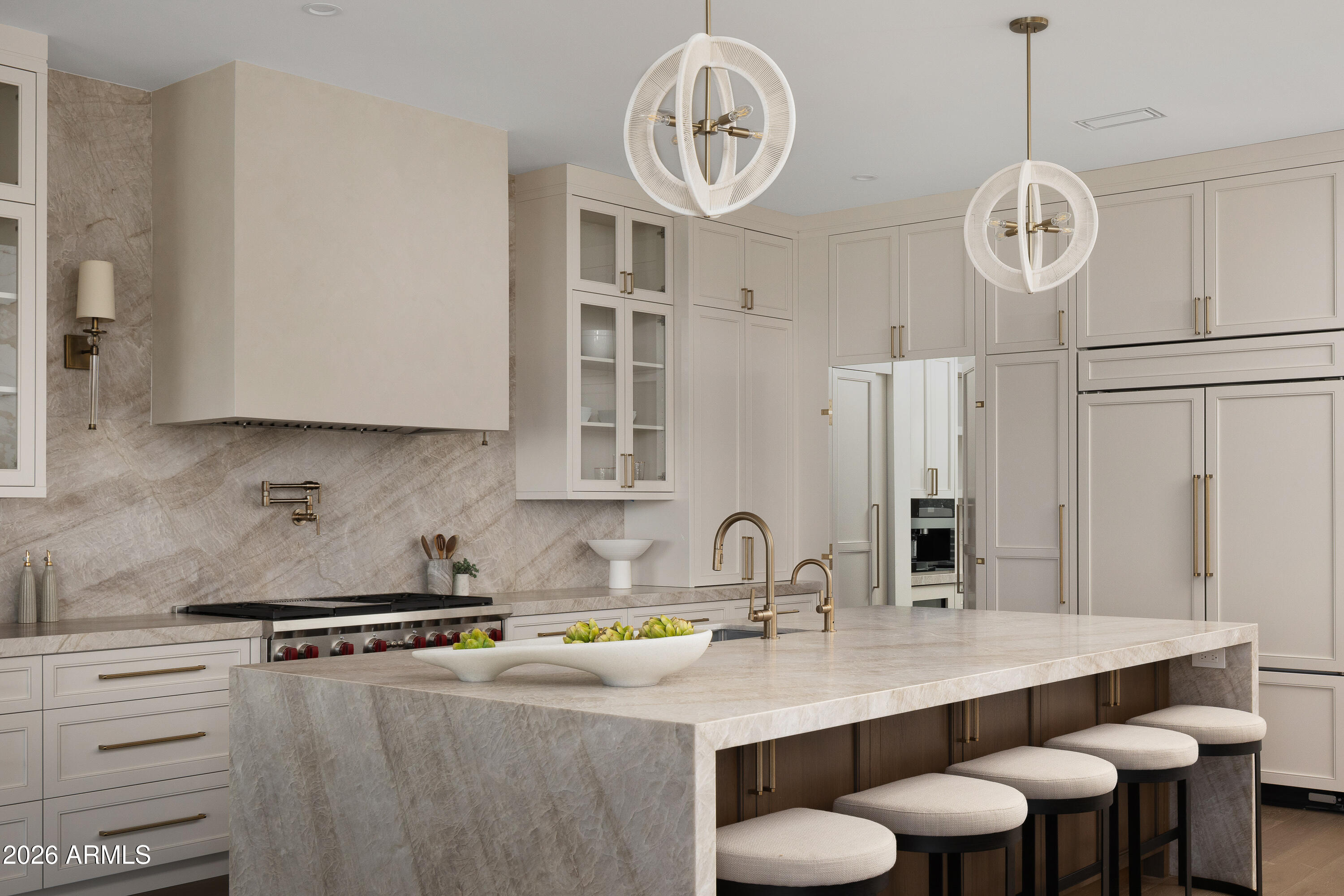 7878 East Gainey Ranch Road, Unit 14 Scottsdale, AZ 85258 - Photo 5 of 40 a kitchen with a table chairs and a stove