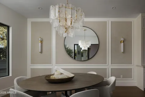 a bathroom with a table and a mirror