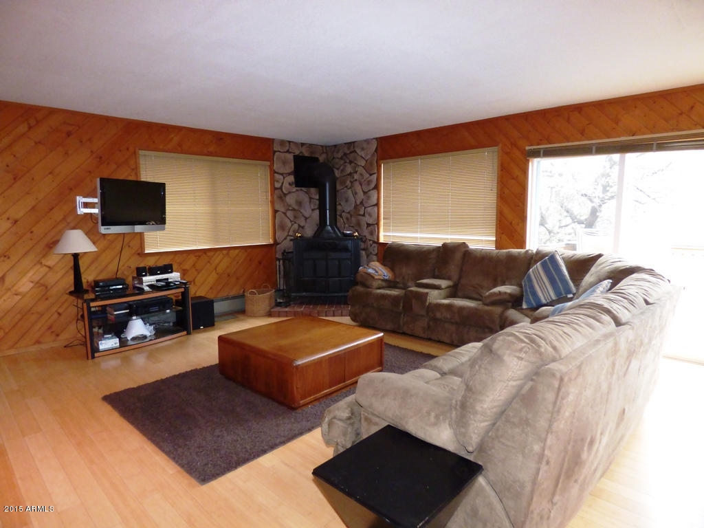 3709 Watertank Road Pine, AZ 85544 - Photo 3 of 22 Greatroom - woodstove