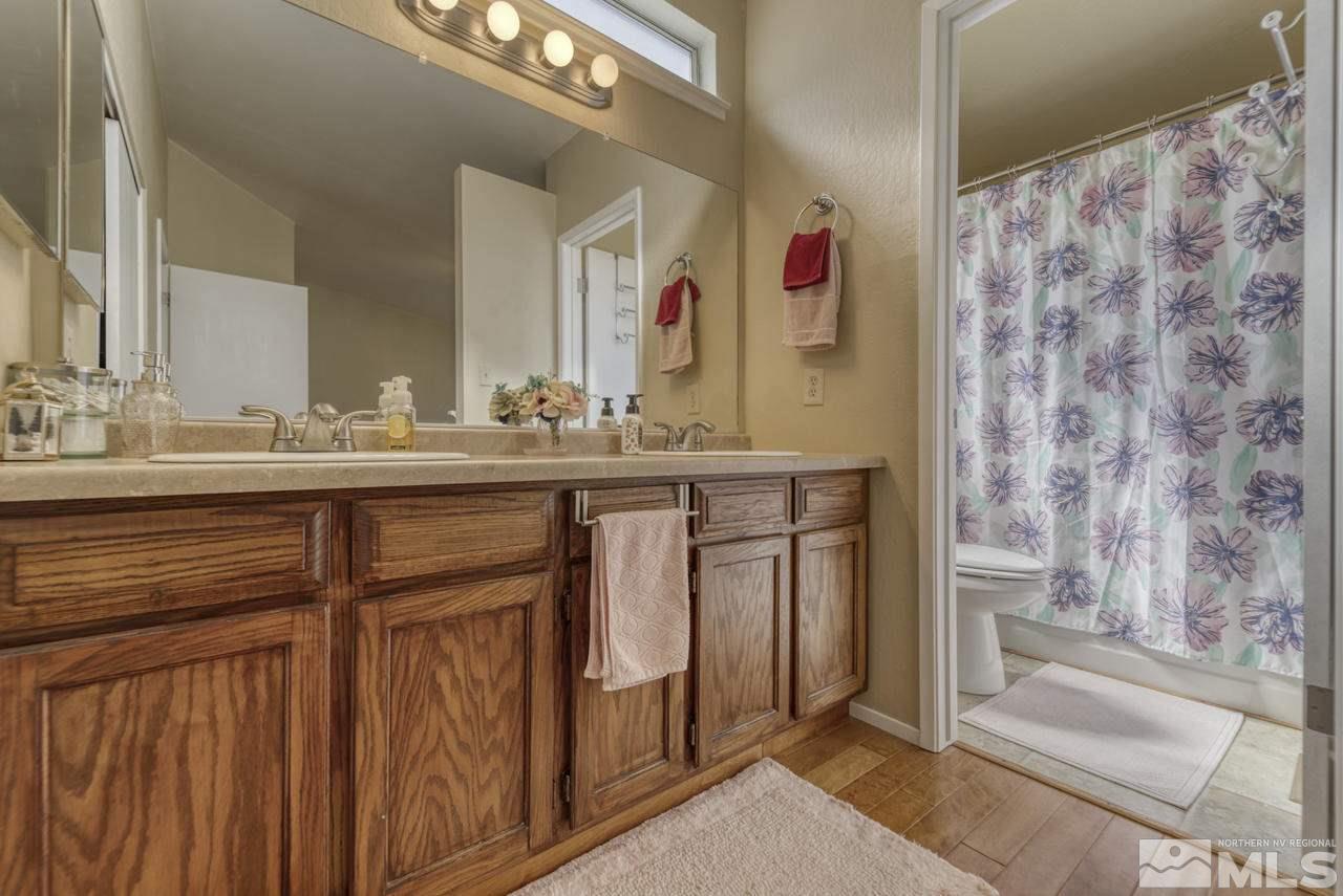1296 Canyon Creek Road Reno, NV 89523 - Photo 17 of 32 a bathroom with a sink and a mirror