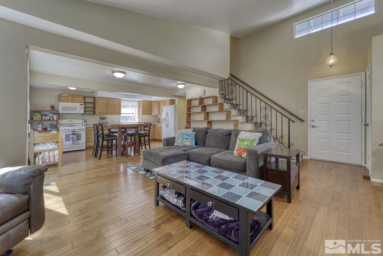 1296 Canyon Creek Road Reno, NV 89523 - Photo 2 of 32 a living room with furniture and wooden floor