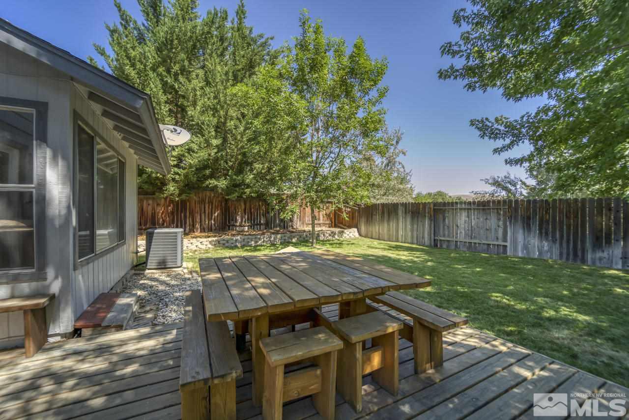 1296 Canyon Creek Road Reno, NV 89523 - Photo 24 of 32 a view of a wooden deck with chairs