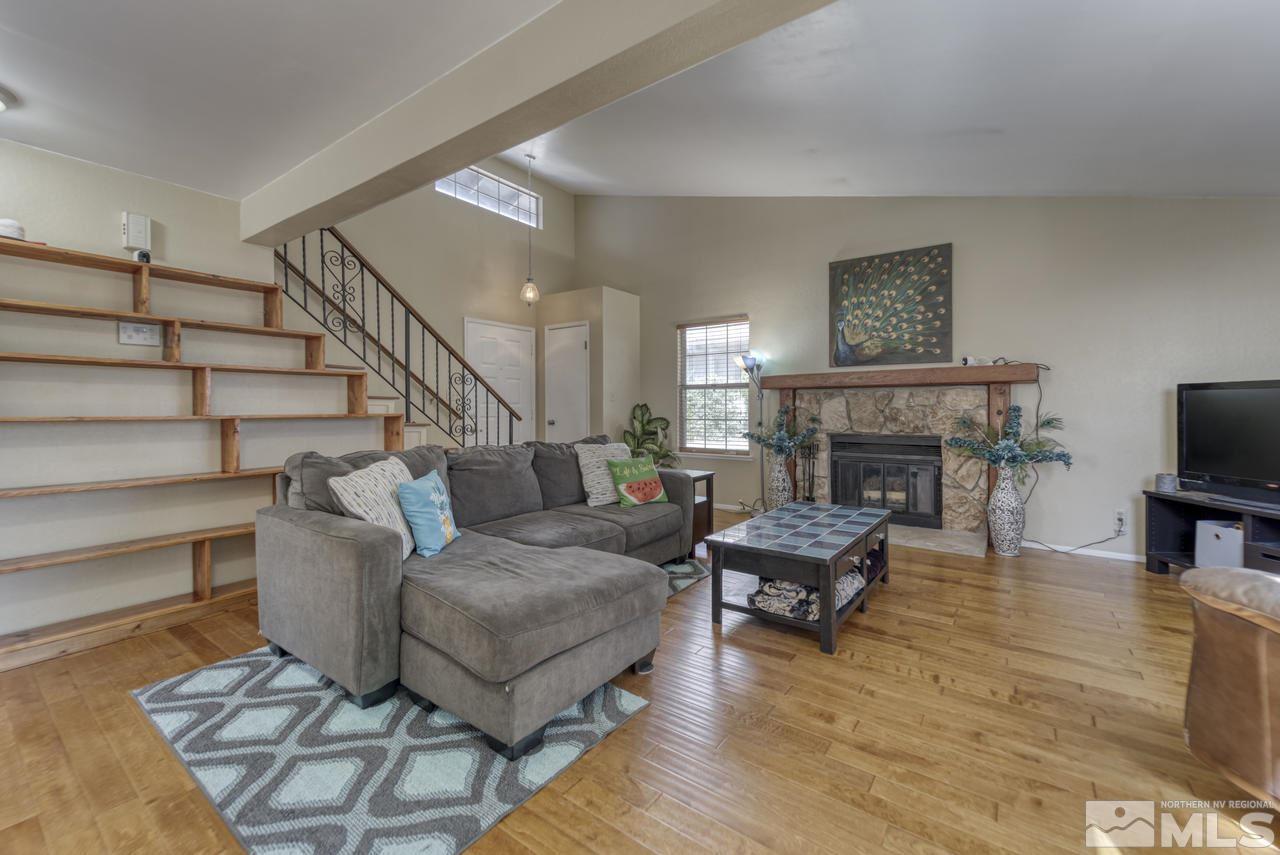 1296 Canyon Creek Road Reno, NV 89523 - Photo 5 of 32 a living room with furniture and a fireplace