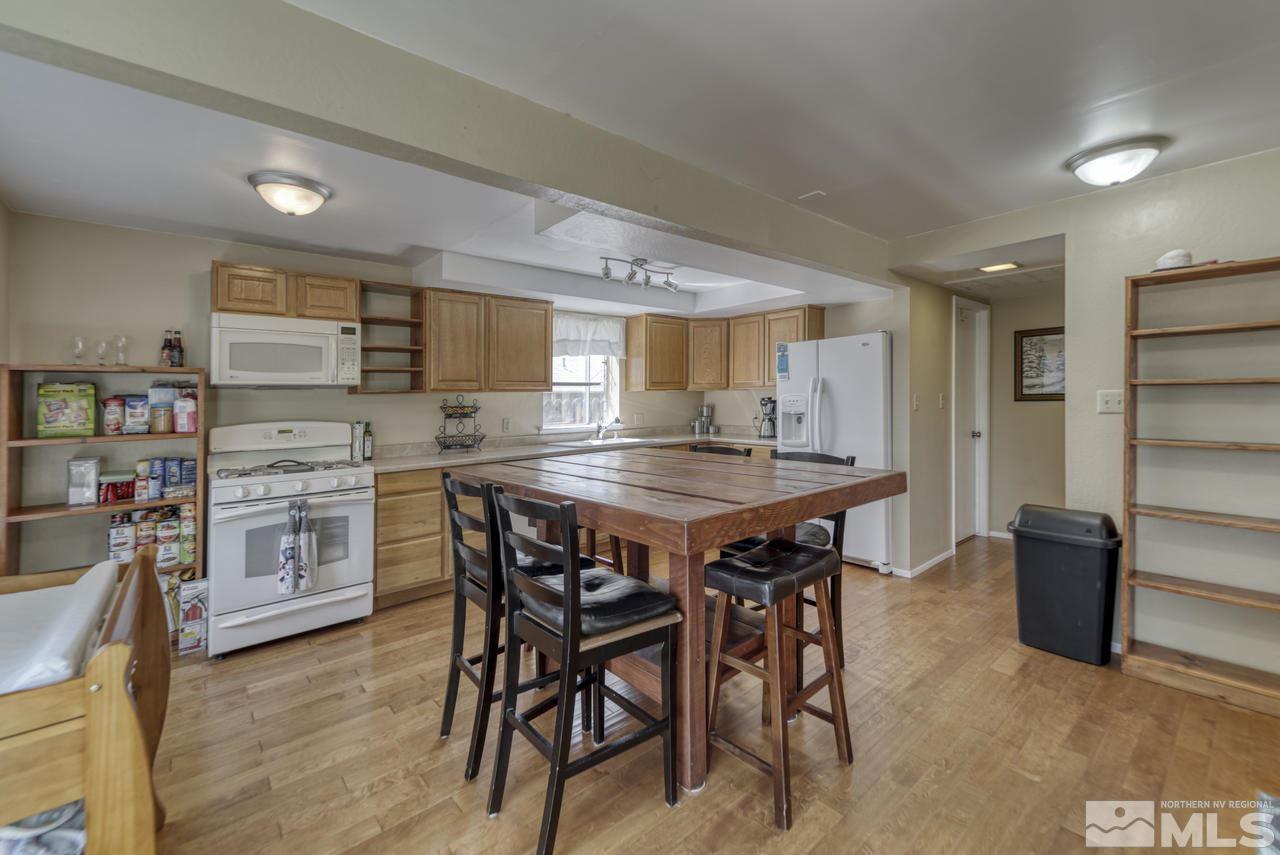 1296 Canyon Creek Road Reno, NV 89523 - Photo 7 of 32 a kitchen with a table and chairs in it