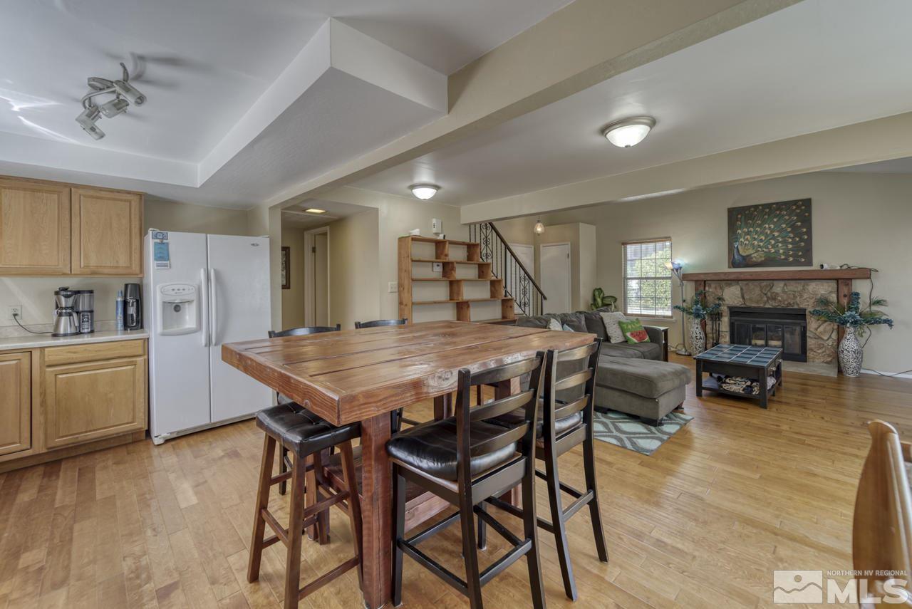 1296 Canyon Creek Road Reno, NV 89523 - Photo 8 of 32 a view of a dining room with furniture and wooden floor
