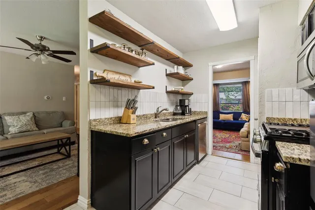 a kitchen with a sink and cabinets