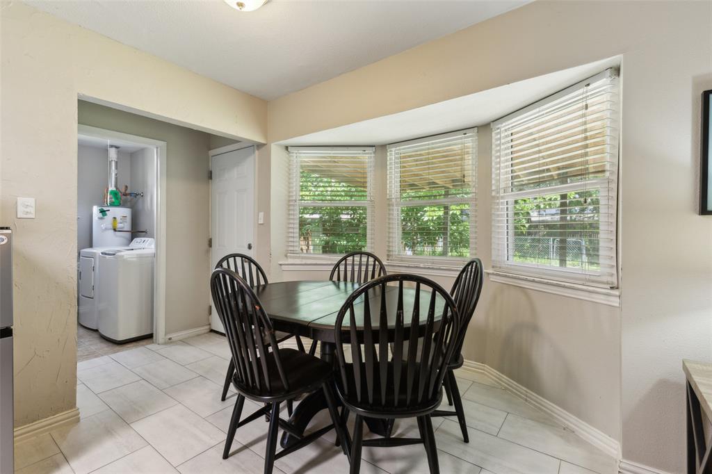 1202 Johns Drive Euless, TX 76039 - Photo 12 of 26 a view of a dining room with furniture window and outside view